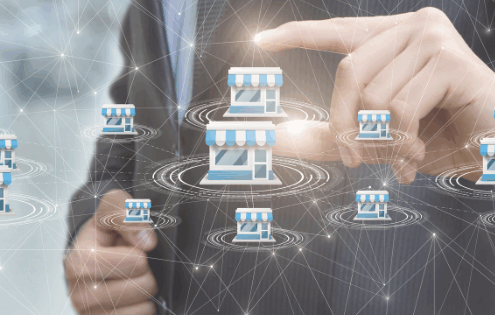 Businessman in a suit selecting a store icon among multiple connected shops – concept of business excellence, franchise management, and network growth.