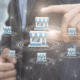Businessman in a suit selecting a store icon among multiple connected shops – concept of business excellence, franchise management, and network growth.