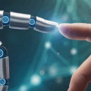 Human hand touching a robotic hand with glowing light – symbol of collaboration between humans and artificial intelligence at BARE International for better customer experience.
