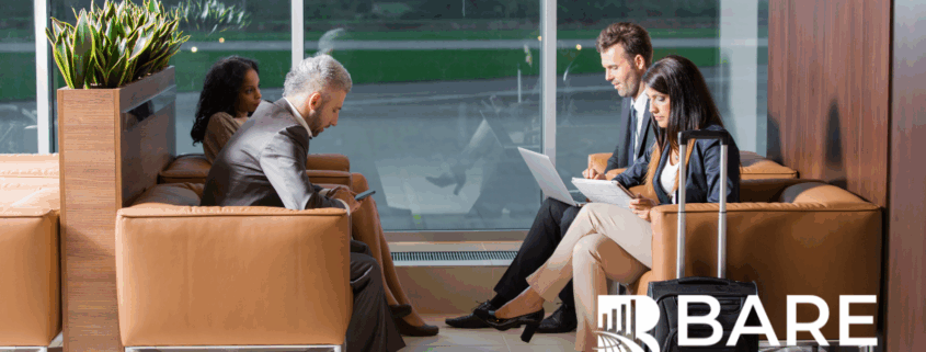 Business Travelers Working in Airport Lounge – BARE International