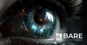 Close-up of a human eye reflecting city lights, symbolizing vision and insight, with BARE International logo.