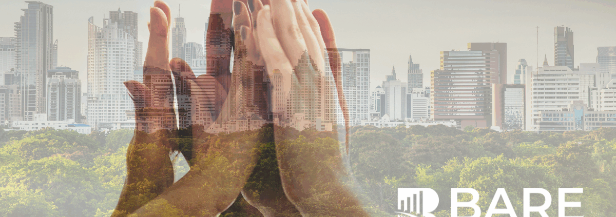 Hands coming together over a city skyline symbolizing ESG-driven customer experience, sustainability, and responsible business growth.