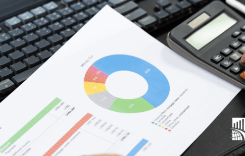 Business professional reviewing customer experience budget charts and analytics while calculating 2026 CX investment priorities.