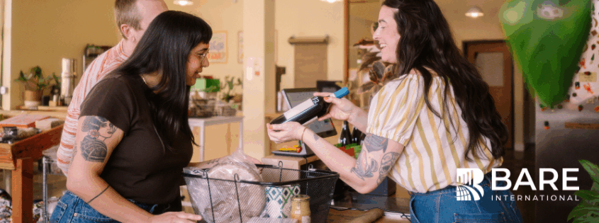 Customer interaction at point of sale illustrating customer experience consistency measured by BARE International